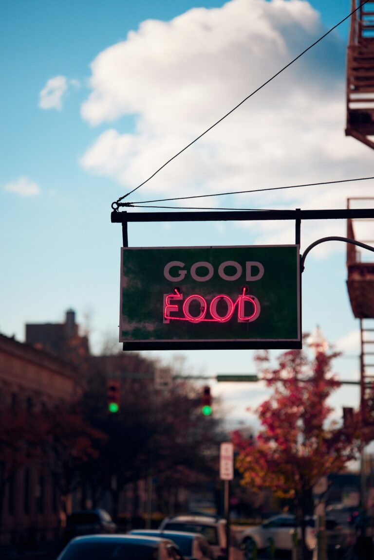 Neon "Good Food" sign on a street