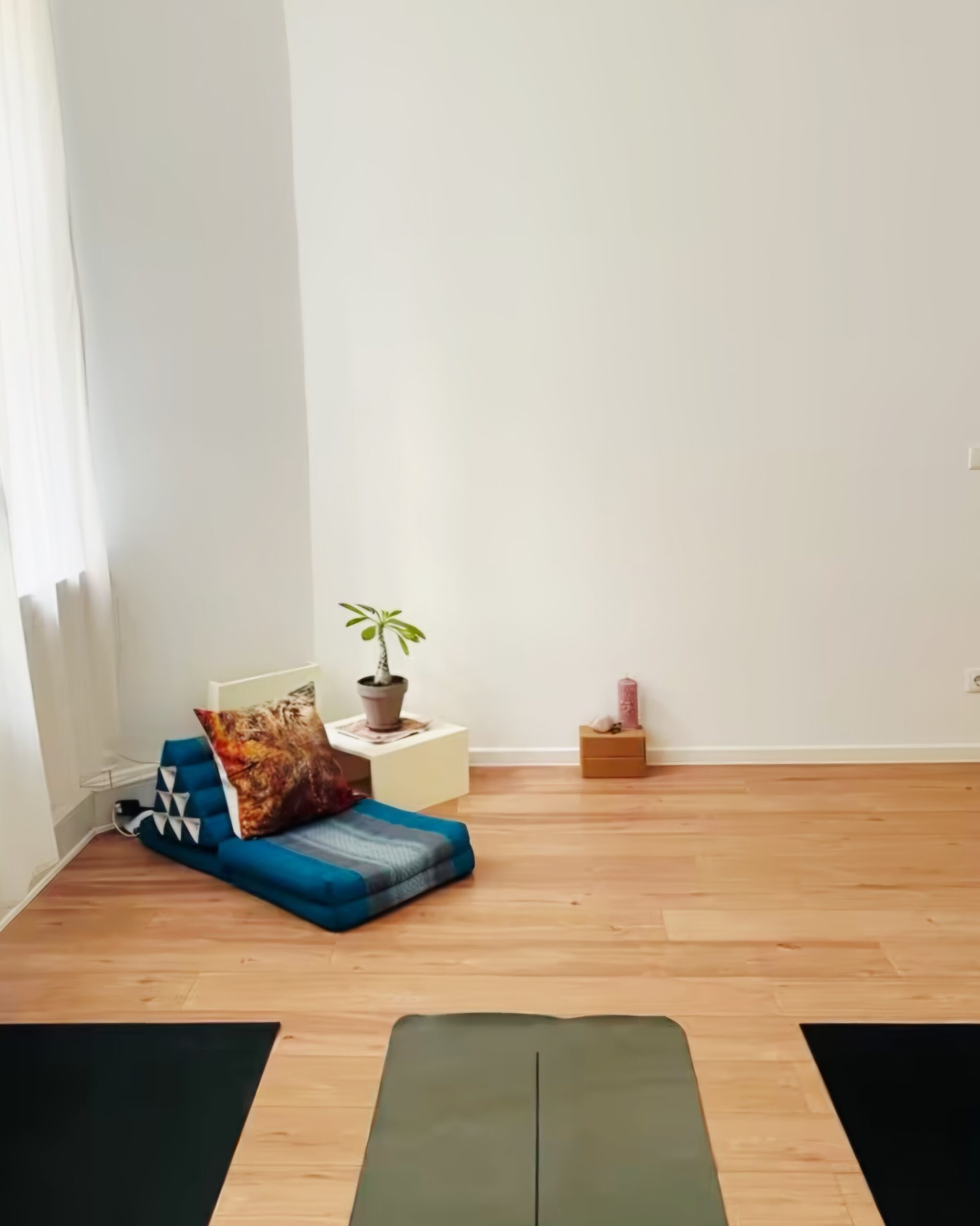 three yoga mats next to each other in a room